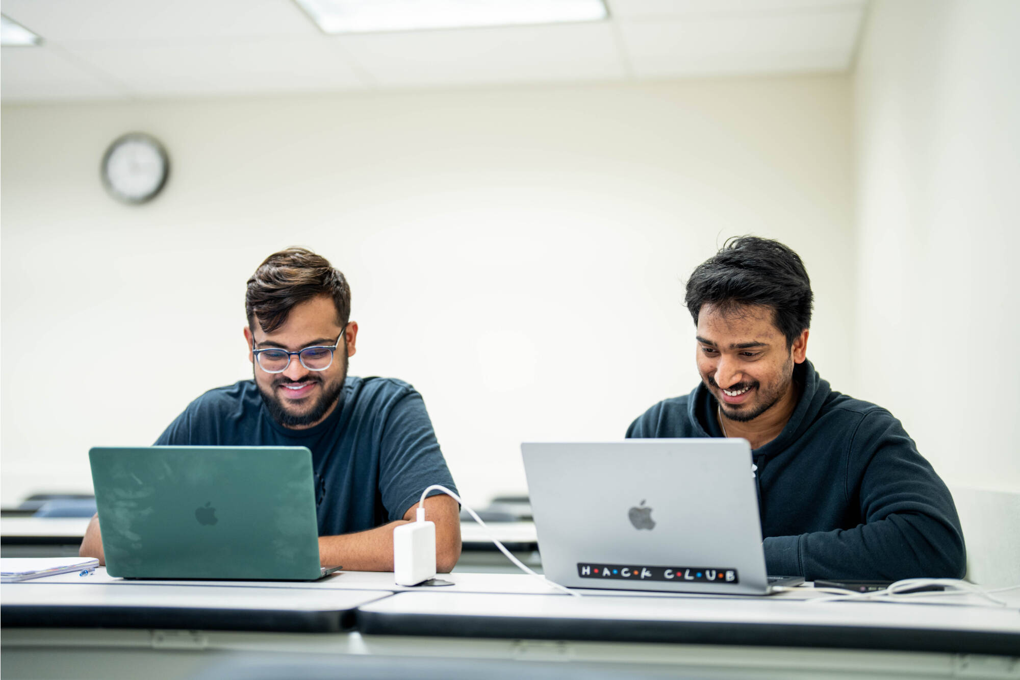 Students looking at their computers.